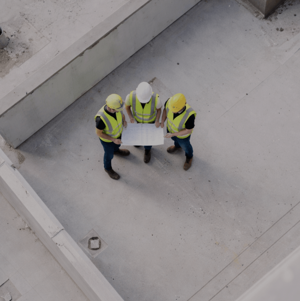 Aerial view of AGREE project managers reviewing plans on a Los Angeles County jobsite